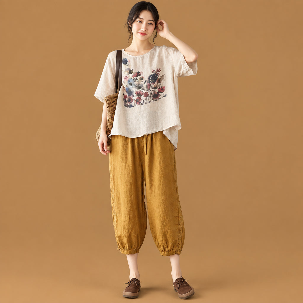 Trendy vintage-inspired women's tee showcasing an abstract ink print graphic and a fashionable irregular hemline
