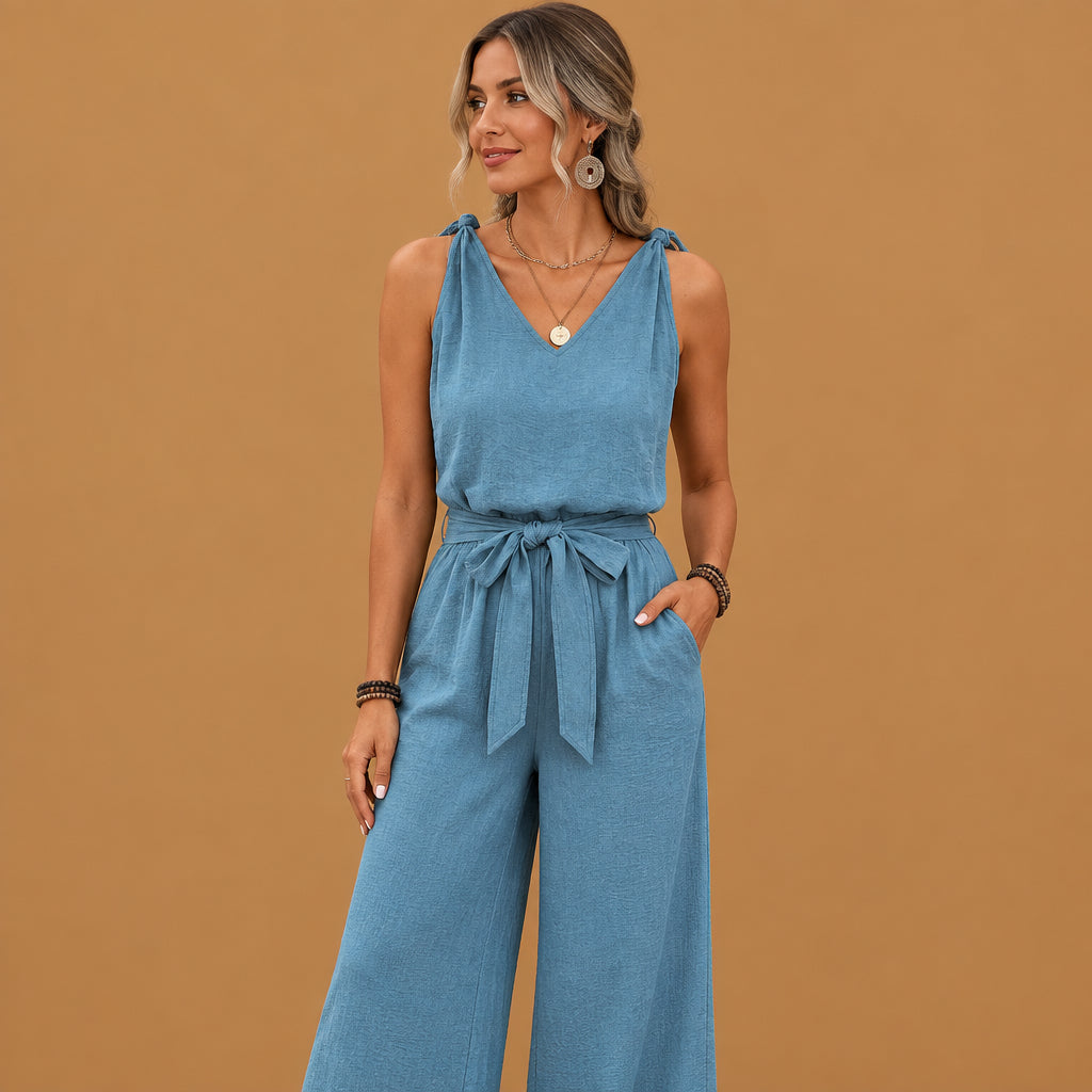 Elegant blue v-neck twist strap jumpsuit for women built with skin-friendly fabric, featuring classic v-neckline aesthetics and smooth texture throughout
