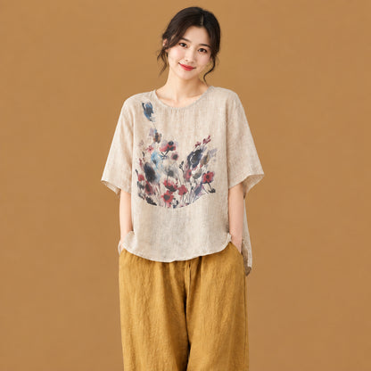 Retro ink splash printed women's asymmetric top offering a relaxed silhouette, short sleeves, and an artistic alternative fashion vibe