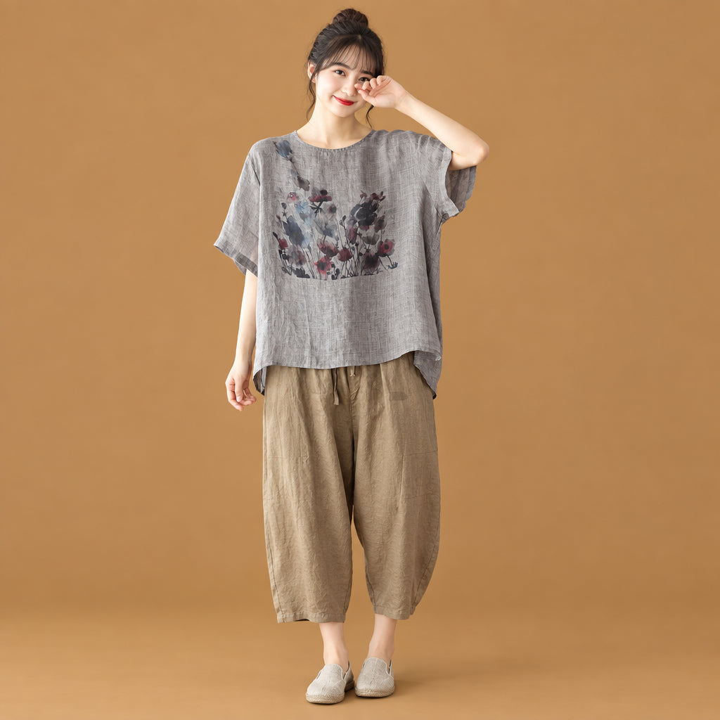 Alternative aesthetic women's short-sleeve top featuring an artistic ink wash print and an asymmetric cut for a distinct silhouette
